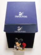 A boxed Swarovski Mickey Mouse brooch.