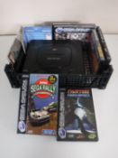 A box containing a Sega Saturn together with six boxed games,