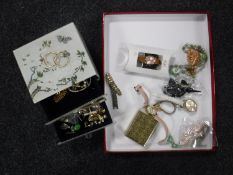 A three drawer glass trinket box containing costume jewellery, lady's watches,