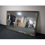 A large gilt framed overmantel mirror,