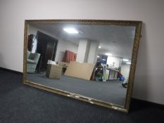 A large gilt framed overmantel mirror,