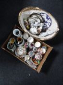 A box and a basket of continental figures, Staffordshire dog, wall plaques, tea china,