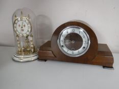 A walnut cased mantel clock and a Kundo anniversary clock under shade