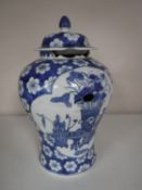 An early 20th century blue and white glazed Japanese lidded vase,