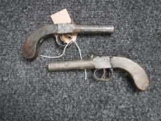 A pair of antique percussion cap pistols,