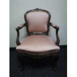 A French salon armchair upholstered in a pink fabric