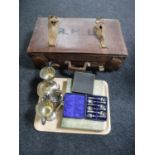 A vintage leather luggage case, tray of plated wares including cutlery, teaspoons, two trophies,