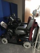 A Mayfair Free Rider mobility cart with keys,