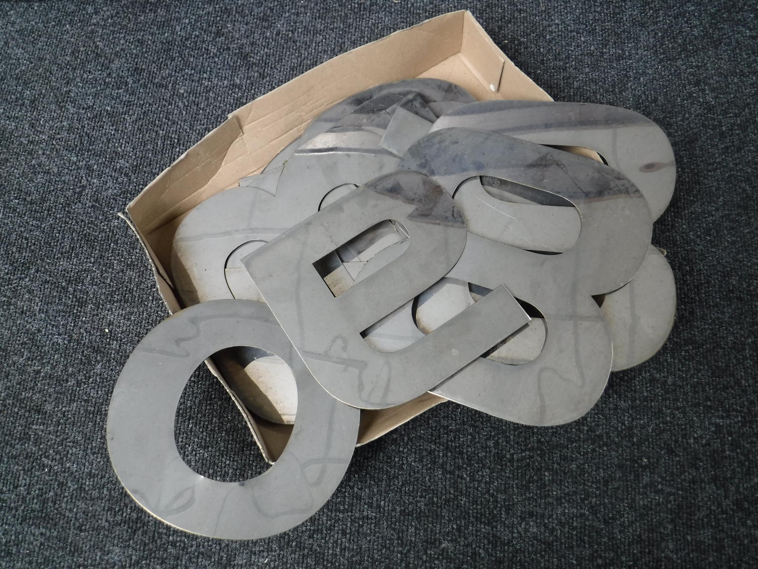 A box of 20th century metal letters