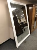 A classical style white framed mirror,