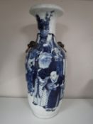 A 20th century blue and white Japanese crackle glaze vase depicting figures,