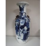 A 20th century blue and white Japanese crackle glaze vase depicting figures,