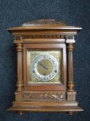 An Edwardian oak bracket clock