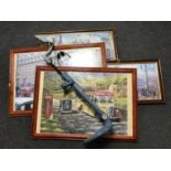 A metal detector and four framed jigsaw puzzles