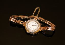 An 18ct gold diamond set cocktail watch on expanding bracelet