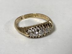 An 18ct gold five stone diamond ring, size J, 2.6g.