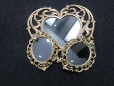 Two small Rococo style mirrors and a heart shaped mirror