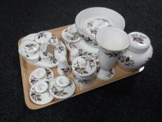 A tray containing twenty-pieces of Wedgwood Hathaway Rose china including salt and pepper pot,