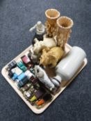 A tray containing two resin elephants together with a pair of resin vases,