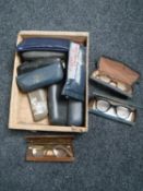 A box of a collection of 20th century spectacles in cases