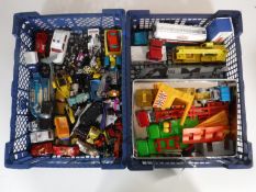 Two boxes of die cast vehicles, Matchbox trucks, Corgi Formula 1 cars, aeroplanes,