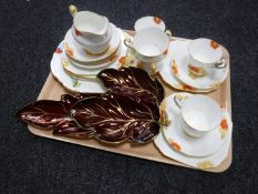 A tray containing two Carlton ware leaf dishes together with nineteen pieces of hand-painted