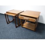 A nest of two teak G Plan tables and a side table fitted a drawer