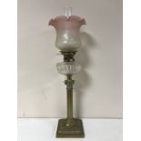 A Victorian glass oil lamp with clear glass reservoir CONDITION REPORT: Shade with