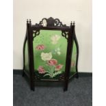 A late Victorian mahogany framed three way folding fire screen with hand painted glass panels