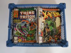 A basket containing approximately sixty 1970's and later Marvel comics