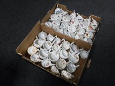 Two boxes containing antique china tea cups with spouts