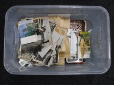 A box containing stamps and stamp magazines,