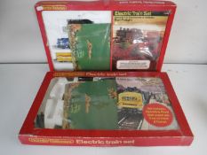 Two boxed Hornby railways electric train sets together with a further box containing track,