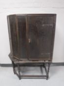 A 19th century corner cabinet and an oak cabinet