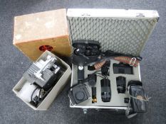 An aluminium case of Chinon CM-3 camera, lens and accessories, boxed Bolex projectors,
