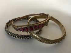 Three antique gold bangles