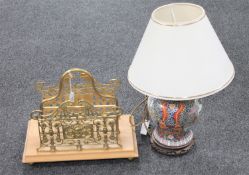 A wooden and brass magazine/correspondence rack together with an oriental porcelain table lamp with