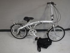 A Land Rover City Lite folding bike with carry bag