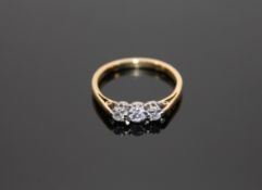 An 18ct gold three stone diamond ring