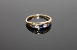 An 18ct gold diamond and sapphire ring, size L, 2.5g.