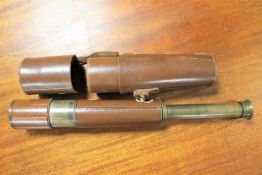 A brass and leather military telescope in leather case CONDITION REPORT: This is