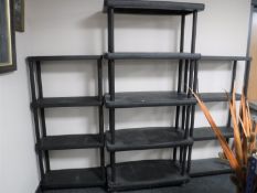 Four sets of plastic storage shelves (3 assembled)
