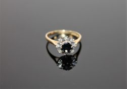 An 18ct gold diamond and sapphire cluster ring CONDITION REPORT: Size O.