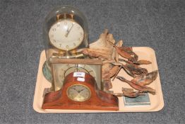 A tray of mid twentieth century mantel clock, Junghan anniversary clock under shade,