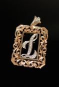 A 14ct gold pendant set 'L' in diamonds, 10.6g.