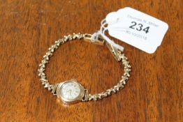 A 9ct gold Regency lady's wrist watch CONDITION REPORT: Both the watch and the strap