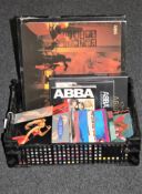 A crate containing a collection of Abba LP's and a small quantity of singles including Tina Turner