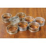 A non-matched suite of eight silver napkin rings - mostly Birmingham mid 1980's.