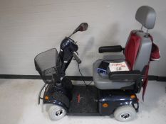 A Free Rider mobility cart with keys,