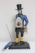 An antique Continental metal figural clock - Man with top hat